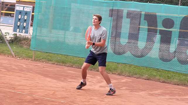 On court in ready position, eyes on the ball
